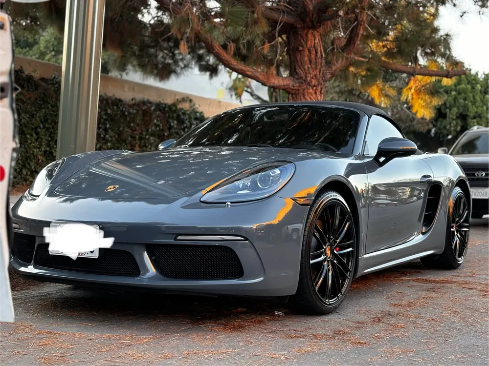 Grey Porsche 718 Boxster parked outdoors