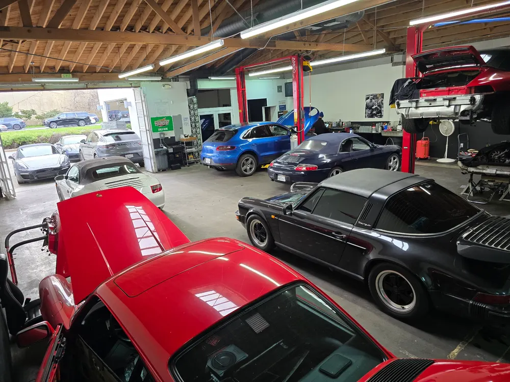 Red and black Porsches on the shop floor at The Werkstatt in West Los Angeles